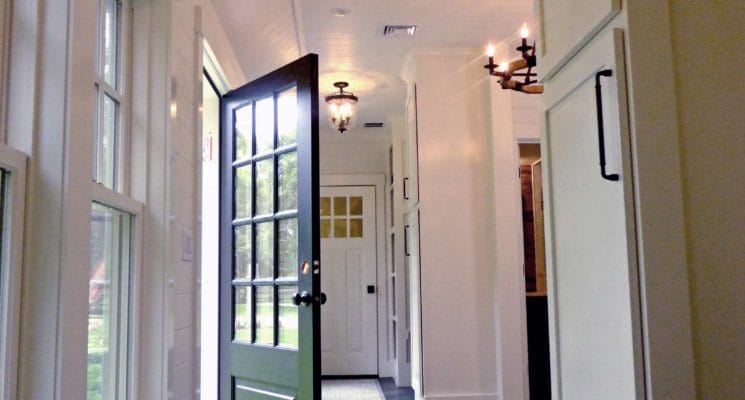 mudroom with green door