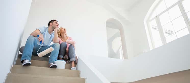 couple sitting looking at newly painted rood 